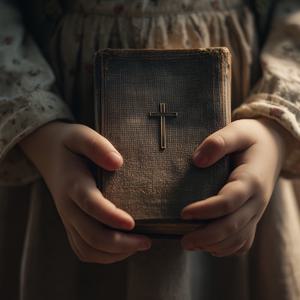 Child Holding Bible