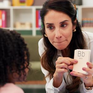 Speech therapy teacher with flashcards