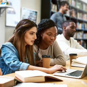 College students studying on laptop